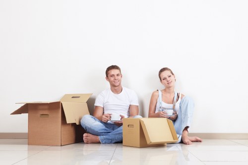 Moving crew handling household items during transport