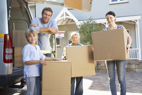 Loading household items into a van for an Eastham move