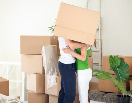 Loading boxes and household items into a van for transport