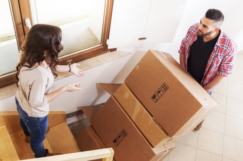 Organised unpacking of boxes into a new home after moving in Eastham