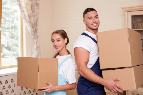 Team handling desks and office furniture during a local business move
