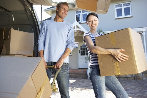 Furniture moving team handling bulky items with care